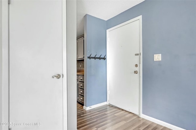 hall with light wood-type flooring