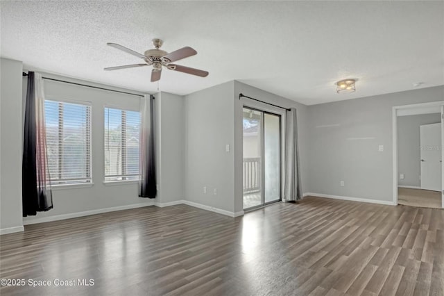 spare room featuring hardwood / wood-style flooring, ceiling fan, and a textured ceiling