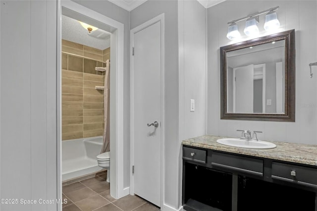 bathroom with vanity, tile patterned floors, and toilet