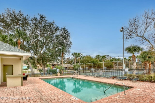 view of swimming pool with a patio area