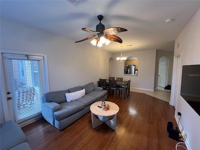 living room featuring hardwood / wood-style flooring and ceiling fan