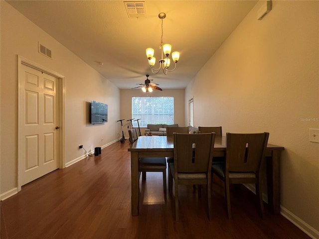 dining area with dark wood-type flooring and ceiling fan with notable chandelier