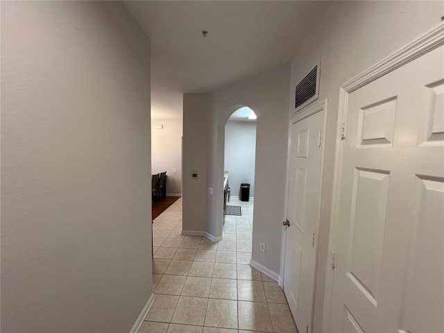 corridor with light tile patterned flooring