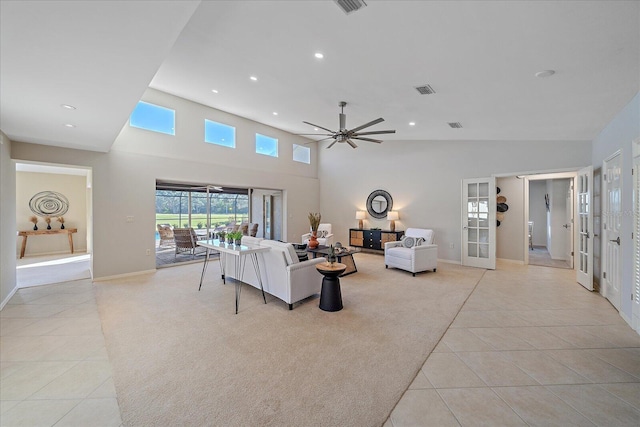 tiled living room with vaulted ceiling, french doors, and ceiling fan