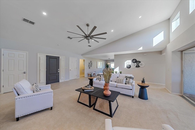 living room with a wealth of natural light, light colored carpet, and ceiling fan