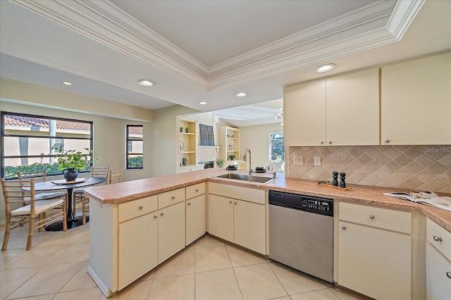 kitchen featuring dishwasher, sink, a healthy amount of sunlight, and kitchen peninsula