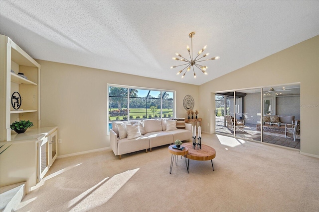 living room featuring light colored carpet, lofted ceiling, a chandelier, and a textured ceiling