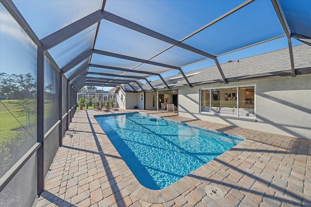 view of pool featuring a lanai and a patio area