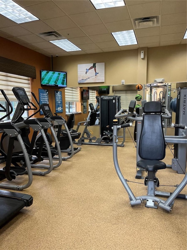 workout area featuring a drop ceiling