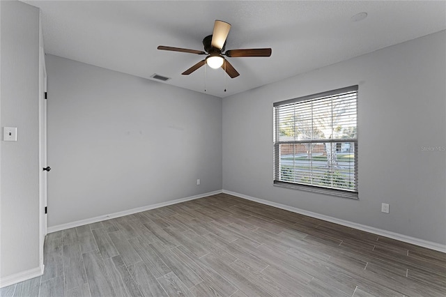 unfurnished room with light hardwood / wood-style floors and ceiling fan