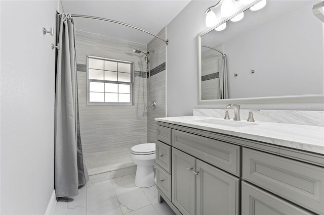 bathroom with vanity, toilet, and a shower with shower curtain