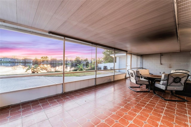 unfurnished sunroom with wooden ceiling