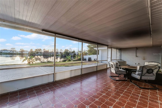 unfurnished sunroom with wood ceiling