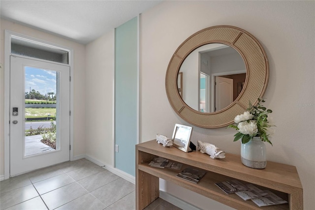 entryway featuring light tile patterned floors