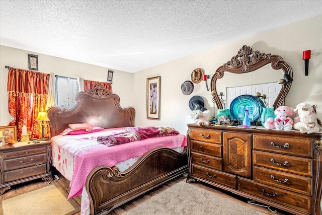 bedroom featuring a textured ceiling