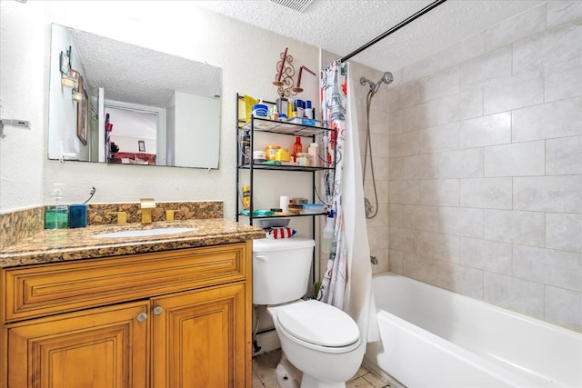 full bathroom featuring vanity, toilet, shower / bath combo, tile patterned floors, and a textured ceiling