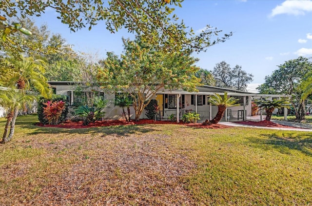 view of front of house featuring covered porch and a front lawn