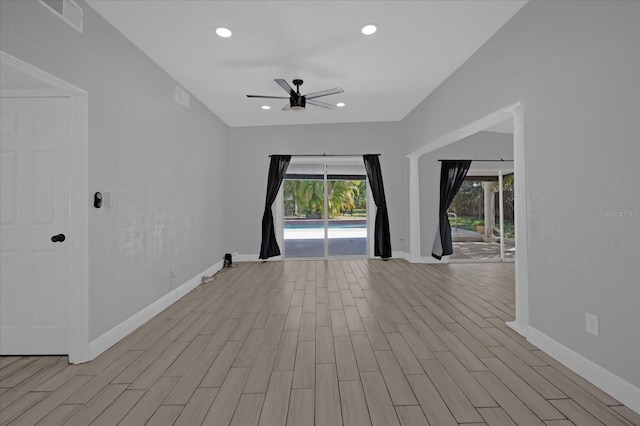 spare room featuring ceiling fan and light hardwood / wood-style flooring