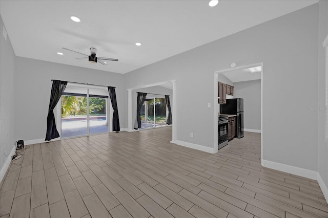 spare room with ceiling fan and light hardwood / wood-style floors