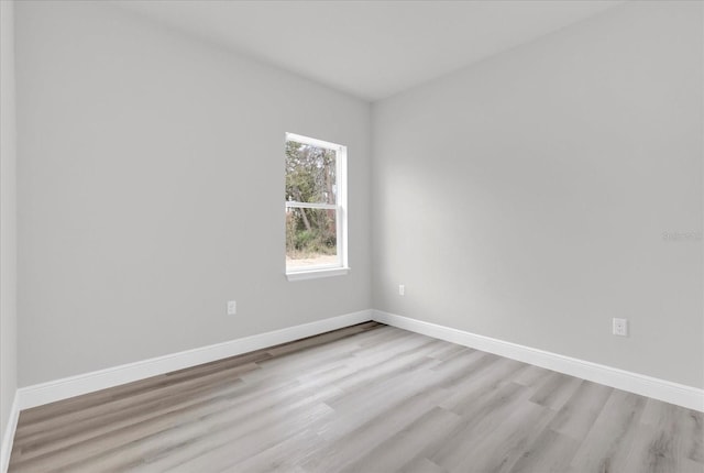 spare room with light wood-type flooring