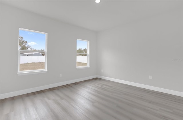 spare room with light wood-type flooring