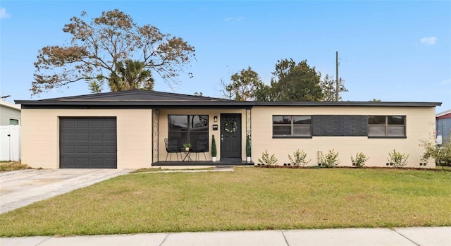 ranch-style house with a garage and a front yard