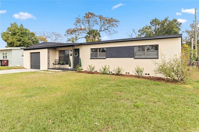 ranch-style home with a garage and a front lawn