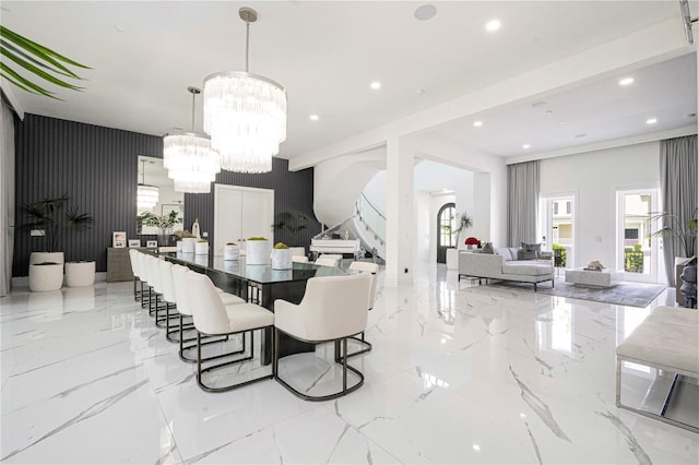 dining area featuring a notable chandelier