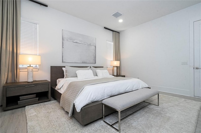 bedroom with light hardwood / wood-style floors