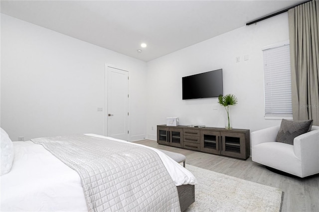 bedroom with light hardwood / wood-style flooring