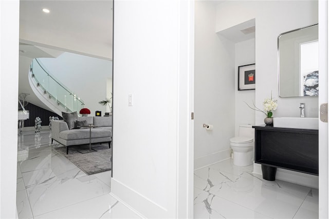 bathroom with vanity and toilet