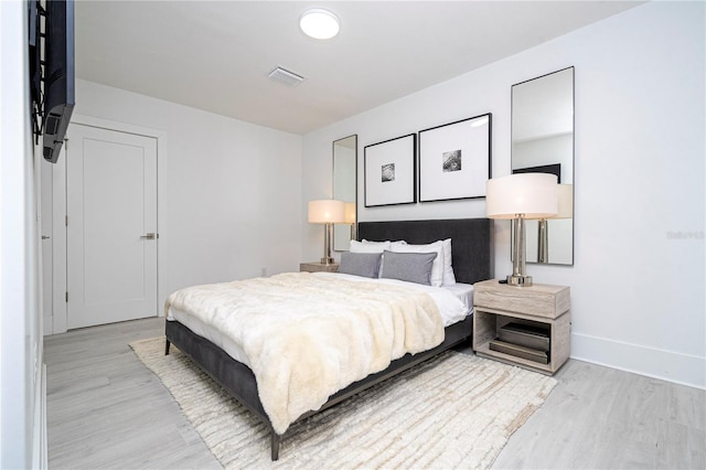 bedroom featuring light hardwood / wood-style floors