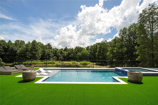 view of pool featuring an in ground hot tub and a yard