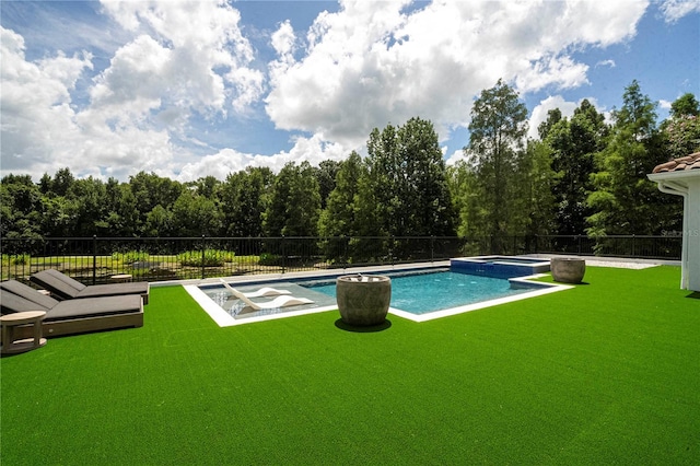 view of swimming pool with a yard and an in ground hot tub