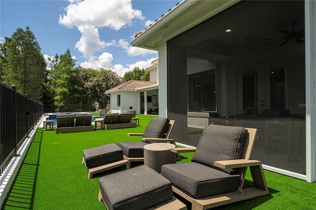 view of yard featuring ceiling fan, a pool, an outdoor hangout area, and a patio