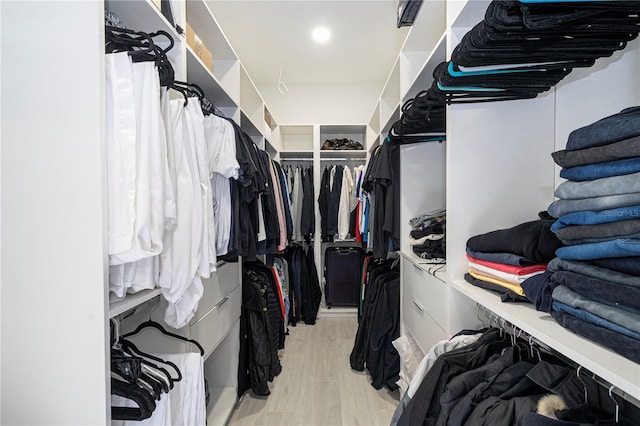 walk in closet featuring light hardwood / wood-style flooring