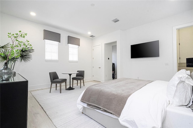 bedroom featuring light hardwood / wood-style floors