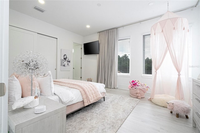 bedroom featuring light wood-type flooring