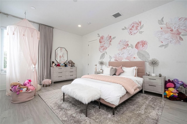 bedroom with light hardwood / wood-style flooring