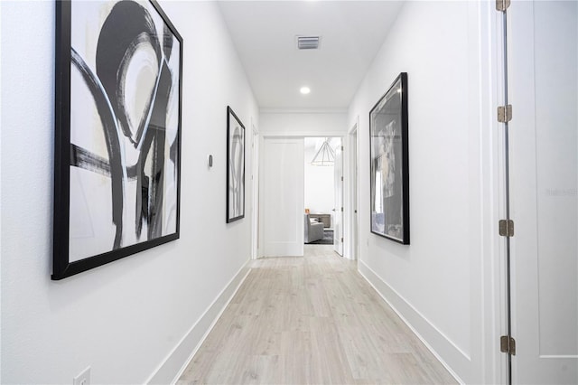 corridor featuring light hardwood / wood-style floors