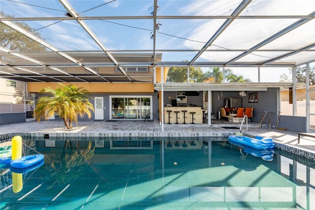 5006 Monet Ave, Belle Isle, FL 32812 - view of pool with a patio, an outdoor hangout area, an outdoor bar, and glass enclosure