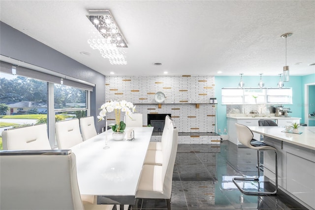 5006 Monet Ave, Belle Isle, FL 32812 - dining space with dark tile patterned flooring and a textured ceiling
