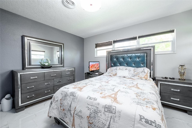 5006 Monet Ave, Belle Isle, FL 32812 - bedroom with multiple windows and a textured ceiling