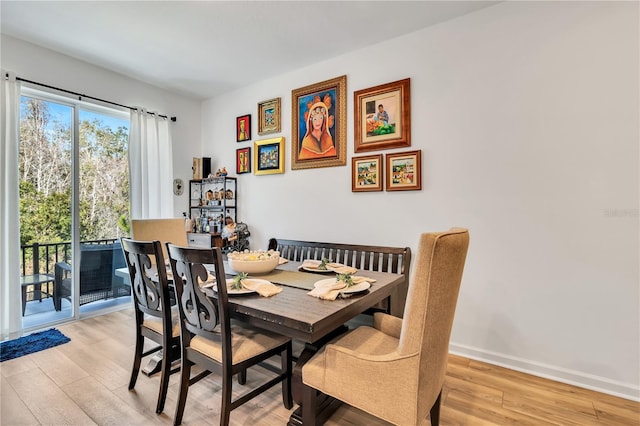 dining room with light wood-type flooring