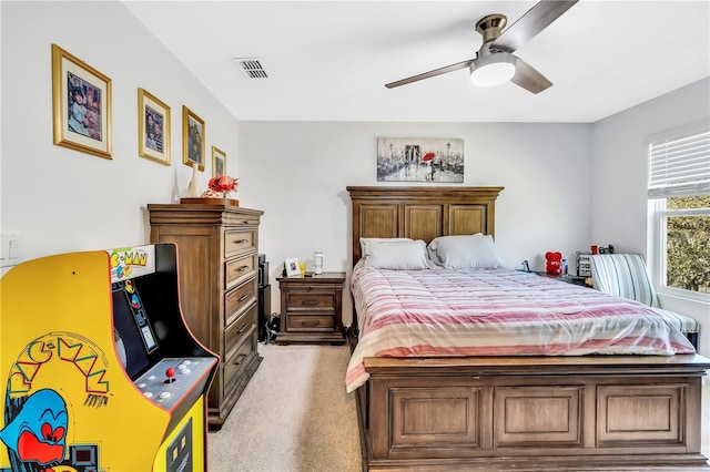 bedroom with light carpet and ceiling fan