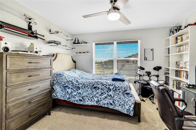 bedroom featuring light colored carpet and ceiling fan