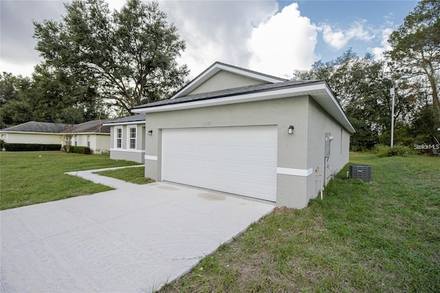 view of front of property featuring a garage, a front lawn, and central air condition unit