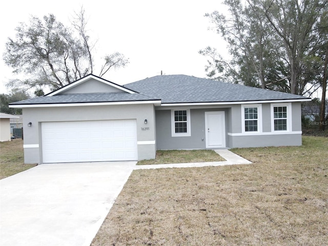 single story home featuring a garage and a front yard