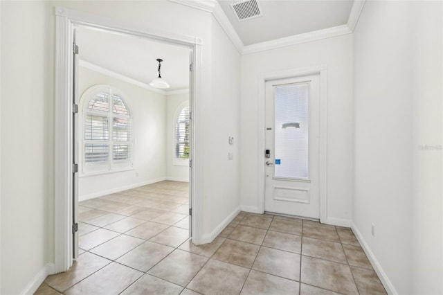 foyer featuring ornamental molding and light tile patterned floors