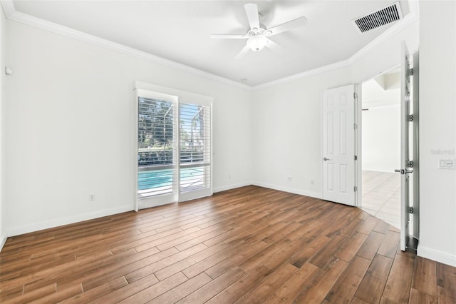 unfurnished room with hardwood / wood-style flooring, ornamental molding, and ceiling fan